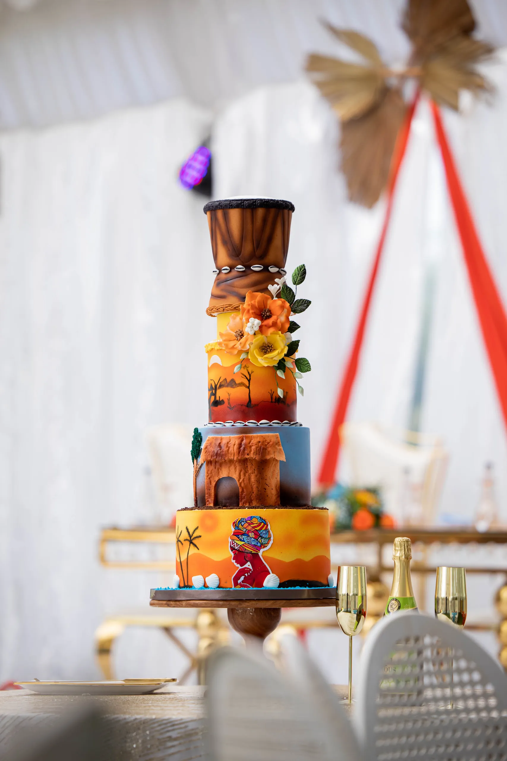 Drum-shaped cake painted with an African pattern