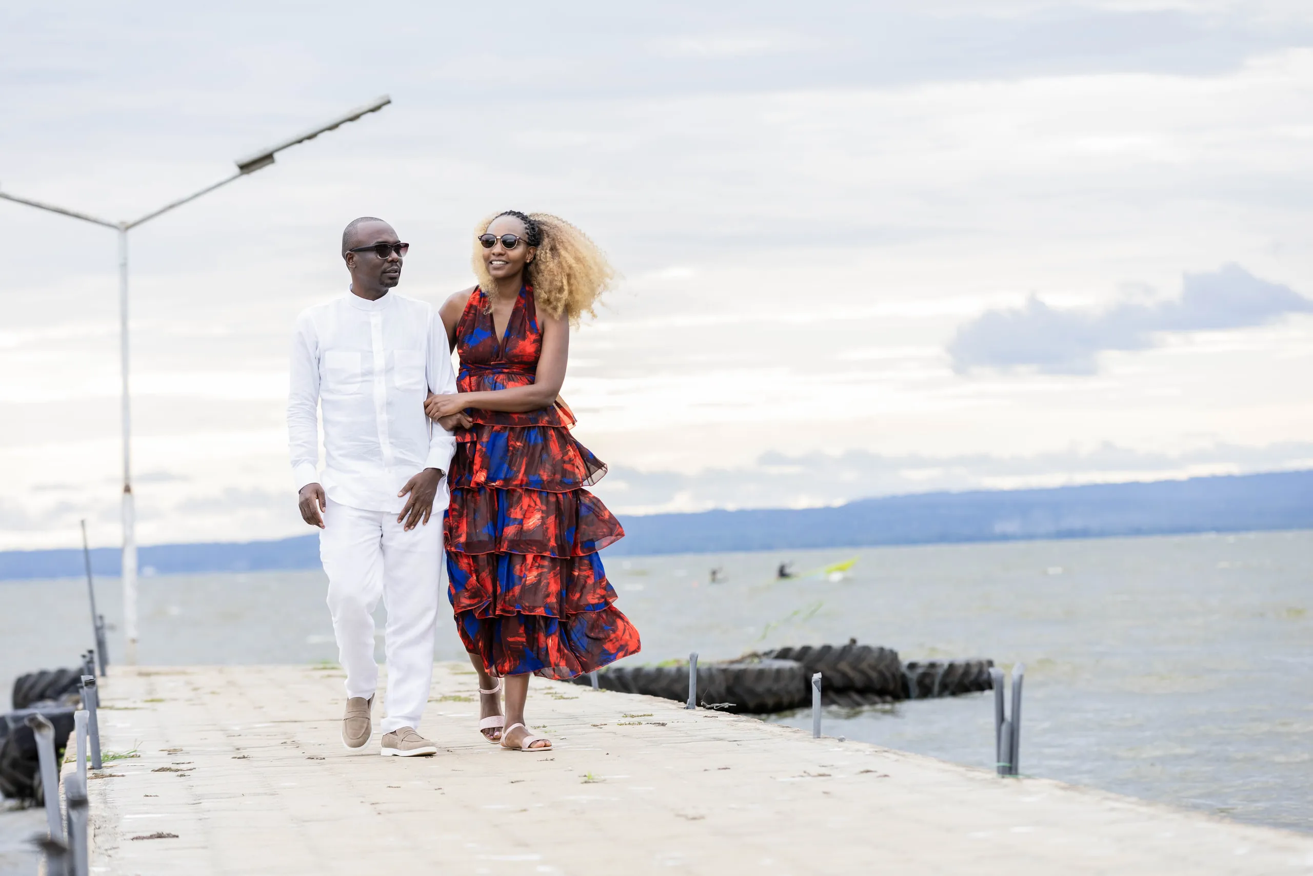 Couple walking along the jetty together