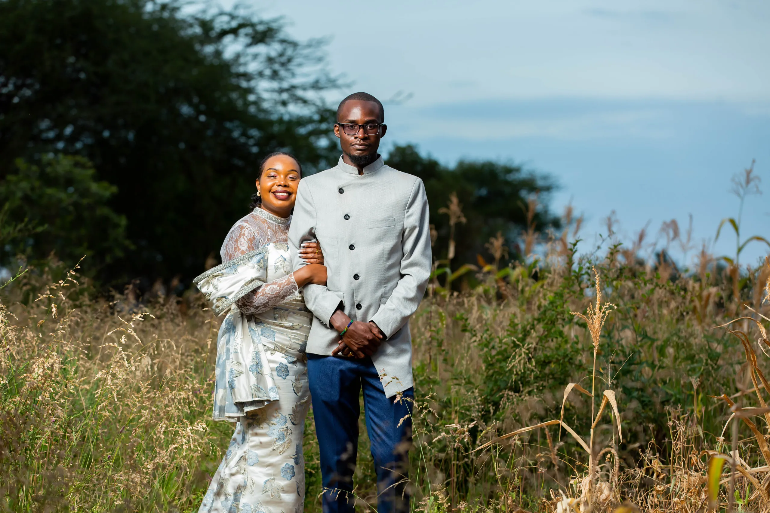 Couple arm in arm in the tall grass